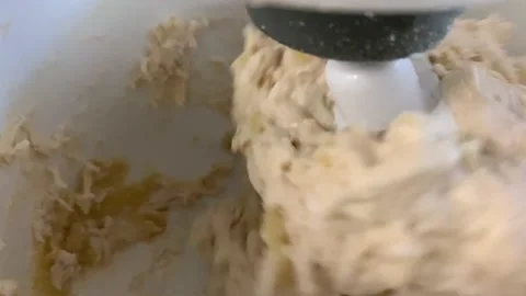 Machine knead bread dough. Raw dough in a industrial bakery dough mixer, food co Stock Footage 203947783