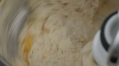 Machine kneading bread and rolls dough. Raw dough made from butter, flour, sugar Stock Footage 145542186