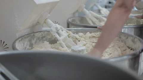 Machine kneading bread dough. Raw dough in a industrial bakery dough mixer Stock-Footage 143962212