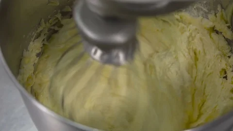 A machine kneading dough, at a bakery restaurant. Dough in the mixer mixes up Stockbeeldmateriaal 73806631