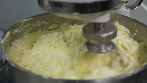 A machine kneading dough, at a bakery restaurant. Dough in the mixer mixes up 스톡 동영상 73811240