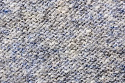 Machine knitted fabric close-up Stock Photos