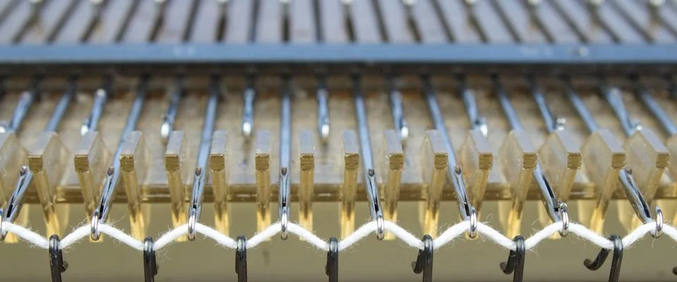 Machine for Knitting, Thread for Knitting. close-up. Fotos de archivo