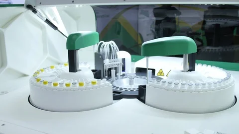 A machine in a laboratory takes samples from a test tube 動画素材 126714527