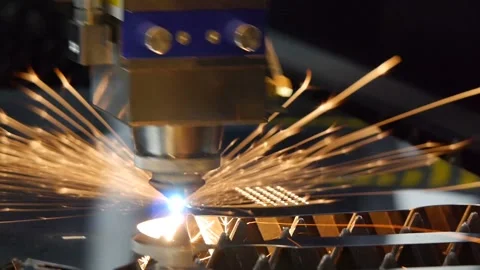 The machine laser cuts out a piece of iron. Sparks fly in all directions Stock Footage 99833859
