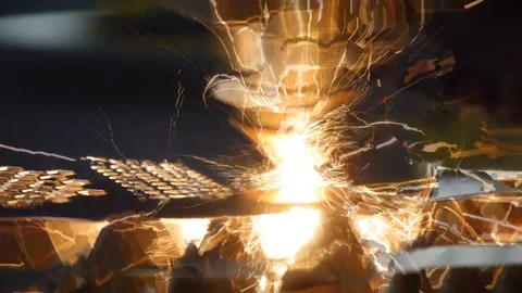 The machine laser cuts out a piece of iron. Sparks close up. Stock Footage 101549565