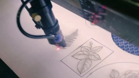 In a machine laser is used to burn a picture onto a wooden surface Stock-Footage 333322528