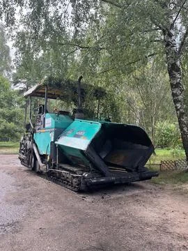Machine for laying fresh asphalt Stock Photos