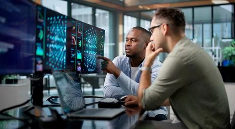 Machine Learning Engineer And Data Scientist Develop AI Models Using Laptop. 库存照片