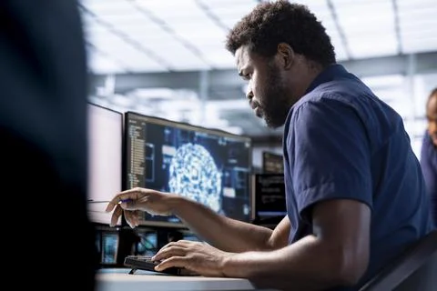 Machine learning expert in data center implementing AI driven solutions Stock Photos
