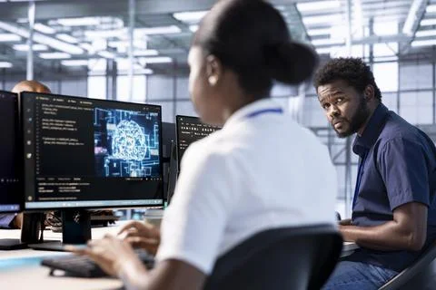Machine learning experts in data center making sure servers are functioning Stock Photos