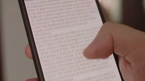 Machine Learning. Scrolling information about XGBoost on mobile phone. Stock Footage 249807592