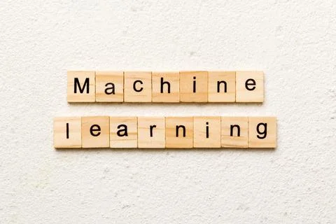 Machine learning word written on wood block. Machine learning text on cemen.. Foto stock