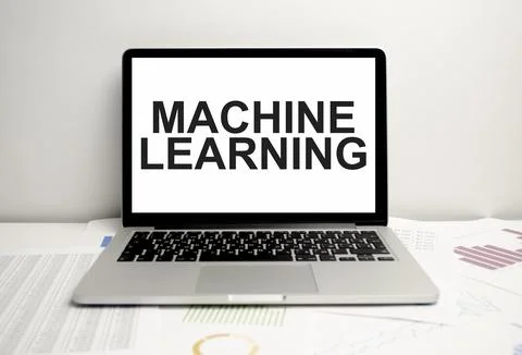Machine learning words on laptop display and charts Stock Photos