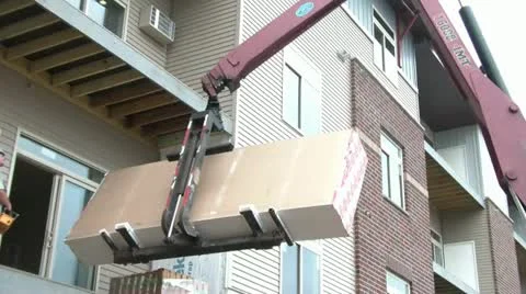 Machine Lifts Sheetrock into Building 스톡 동영상 12594010