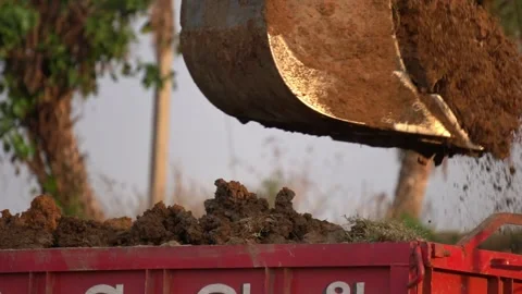 Machine Loading Soil into Tractor Bucket Construction Work. Stock Footage 331958375