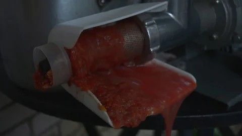 Machine makes fresh tomato juice Stock Footage 94005200