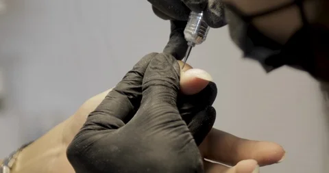Machine manicure service closeup. Removing cuticle with nail drill Stock Footage 115047568