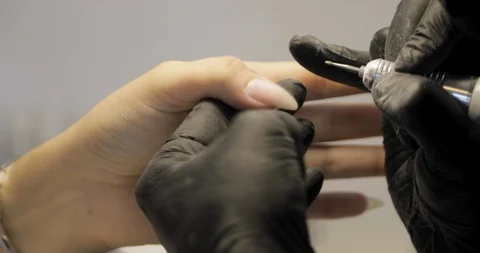Machine manicure service closeup. Removing cuticle with nail drill Stock Footage 115048146