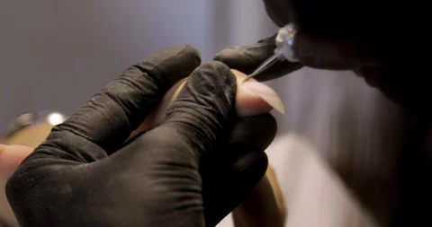 Machine manicure service closeup. Removing cuticle with nail drill Stock Footage 115049320