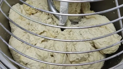 The machine mixes the dough Stock Footage 164071374