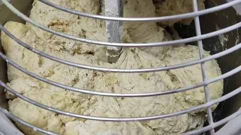 The machine mixes the dough Stock Footage 164071380