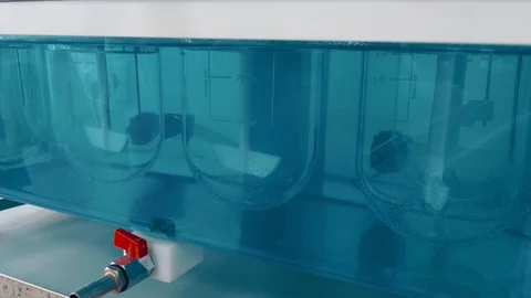 Machine mixes a solution for the invention of a new therapeutic drug Stock Footage 119201108