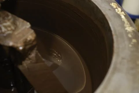 Machine for mixing chocolate. Close up Stock Photos