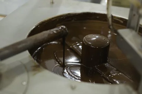 Machine for mixing chocolate. Close up Stock Photos
