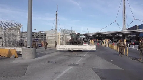 Machine moving concrete barrier for installation at San Ysidro Port of Entry Stock Footage 98341750