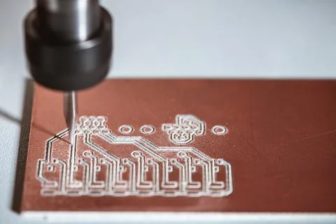 Machine with numerical control CNC carries out milling of printed circuit boa Stock Photos