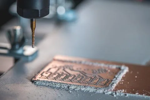 Machine with numerical control CNC carries out milling of printed circuit b.. Stock Photos