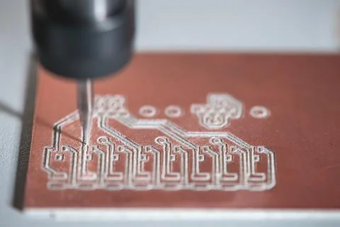 Machine with numerical control CNC carries out milling of printed circuit boa Stock Photos