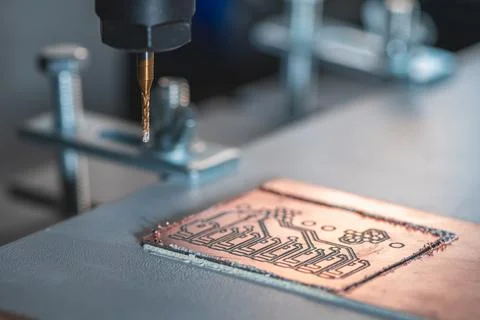 Machine with numerical control CNC carries out milling of printed circuit b.. Stock Photos