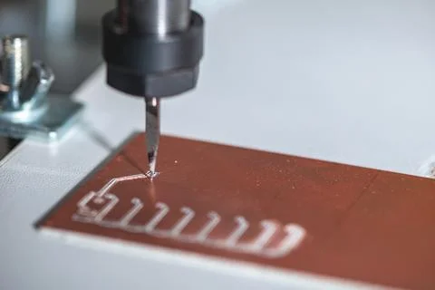 Machine with numerical control CNC carries out milling of printed circuit b.. Stock Photos