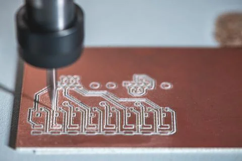 Machine with numerical control CNC carries out milling of printed circuit boa Stock Photos