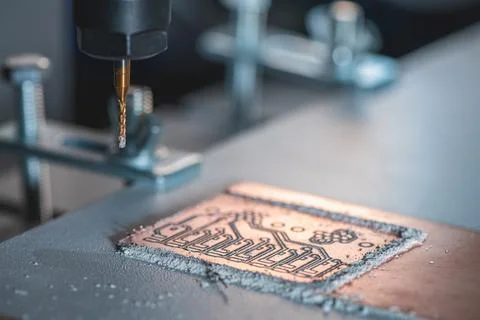 Machine with numerical control CNC carries out milling of printed circuit b.. Stock Photos