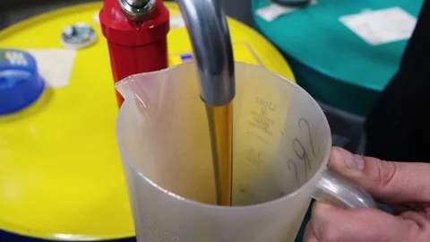 Machine oil. New engine oil is poured into the container. replacement of Video stock 165651069