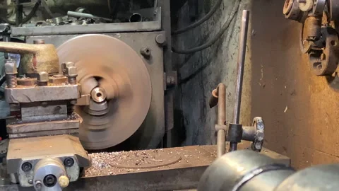 The machine is in operation. Sharpening a part made of brass metal Stock Footage 243192947