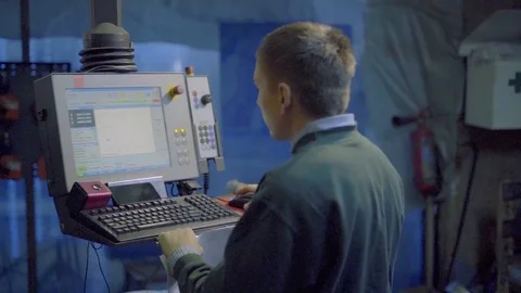 Machine operator at the control panel 스톡 동영상 98607521