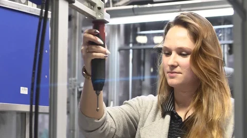 Machine Operator is Screwing the Component in the Assembly Line by Screwdriver 動画素材 127029556