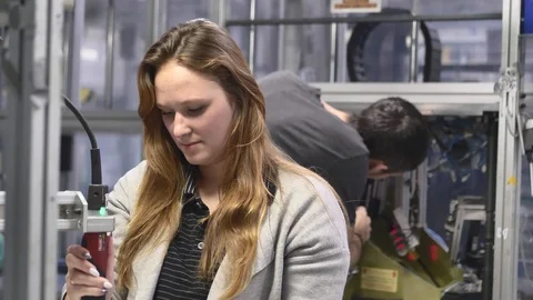 Machine Operator is Screwing the Component in the Assembly Line by Screwdriver 動画素材 127030147