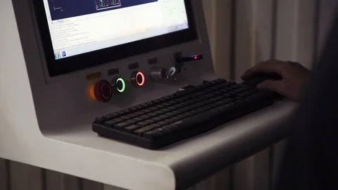 Machine operator sets laser cutting parameters Stock Footage 108648271