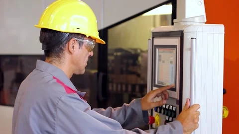 Machine Operator Uses Control Panel and Programmes the Machine Vidéo 249751306