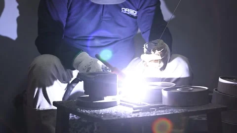 Machine operator wearing safety gear doing TIG and Mig welding. Stock Footage 252116569