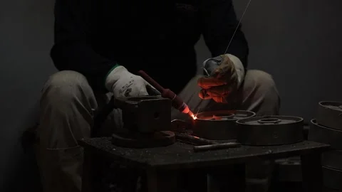 Machine operator wearing safety gear doing TIG and Mig welding. Stock Footage 252116594