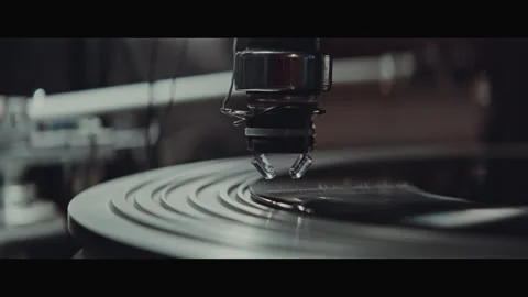 Machine part engraving into a spinning vinyl disc indoors Stock Footage 254898122