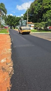 Machine paving the road Stock Photos