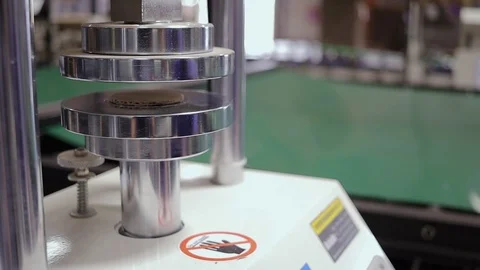 Machine performing a test by flat crushing a sample of corrugated 스톡 동영상 105325793