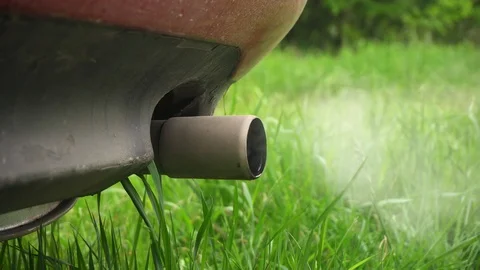 Machine pipe smoke condensate water. Closeup of machine exhaust pipe releasing Stockbeeldmateriaal 110920184